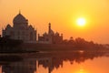 Taj Mahal reflected in Yamuna river at sunset in Agra, India