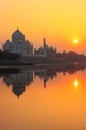 Taj Mahal reflected in Yamuna river at sunset in Agra, India