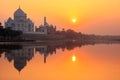 Taj Mahal reflected in Yamuna river at sunset in Agra, India