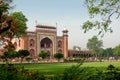 Taj Mahal`s western gate at sunrise, Agra, India