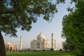 Taj Mahal tomb and green grass at blue sky in Agra, India