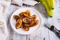 Tajadas fried banana on a plate on the table Royalty Free Stock Photo