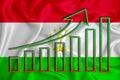 Tajikistan flag with a graph of price increases for the country`s currency. Rising prices for shares of companies and