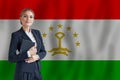 Tajikistani businesswoman on the flag of Talikistan digital nomad, business, startup concept