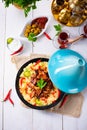 Tajin with couscous, vegetables and meat on white background