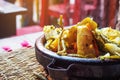 Tajine or tagine - traditional Berber dish served in earthenware bowl at typical Moroccan street restaurant, closeup detail