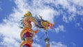 Tak Thailand, June 23, 2022. Dragon sculpture high in the blue sky with white clouds, a Thai work of art
