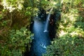 Takachiho Gorge with waterfall, boats and green trees. Royalty Free Stock Photo