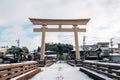 Sakurayama Hachimangu Shrine Torii gate with winter snow in Takayama, Gifu, Japan