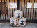 TAKAYAMA, JAPAN - MAY 2019: Three traditional sake barrels outside Harada sake brewery in the old city center