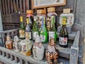 TAKAYAMA, JAPAN - MAY 2019: Variety of sake bottles outside a brewery shop