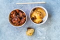 Take Away Asian Food Chinese General Tsos Chicken, Fried Pineapple Fritters Caramelized with Cinnamon and Sesame Seeds and Banana