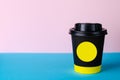 Take away black coffee cup on blue background.mock up