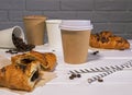 Take Away Coffee with Fresh Croissant With Chocolate and Coffee Beans on wooden background, Copy Space Royalty Free Stock Photo
