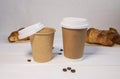 Take Away Coffee and Fresh Croissant With Chocolate drops on wooden background, Copy Space Royalty Free Stock Photo