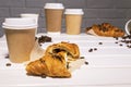 Take Away Coffee with Fresh Croissant With Chocolate and Coffee Beans on wooden background, Copy Space Royalty Free Stock Photo