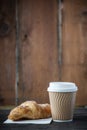 Take away coffee and fresh croissant Royalty Free Stock Photo