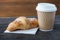 Take away coffee and fresh croissant Royalty Free Stock Photo