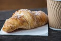 Take away coffee and fresh croissant Royalty Free Stock Photo