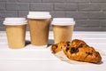 Take Away Coffee in Paper Eco Cup and Fresh Croissant With Chocolate drops on wooden background, Copy Space Royalty Free Stock Photo