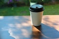 Take away cup for hot coffee drink put on wooden table in cafe Royalty Free Stock Photo