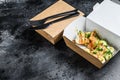 Take away food paper box with sandwich. Black background. Top view. Copy space Royalty Free Stock Photo