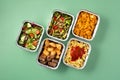 Take away healthy food in foil boxes Royalty Free Stock Photo