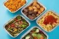 Take away healthy food in foil boxes Royalty Free Stock Photo