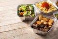 Take away healthy food in foil boxes Royalty Free Stock Photo