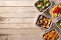 Take away healthy food in foil boxes Royalty Free Stock Photo