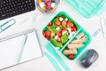 Take away lunch box with fresh salad and tuna fish over the offi Royalty Free Stock Photo