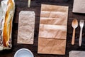 Take away with sandwich and paper bags table background top view Royalty Free Stock Photo