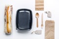 Take away with sandwich and paper bags on table background top view Royalty Free Stock Photo