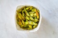 Take Away Steamed Edamame Bean, Green Soybean in a pan, East Asian Cuisine