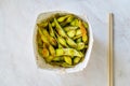 Take Away Steamed Edamame Bean, Green Soybean in a pan, East Asian Cuisine