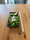 Take Away Sushi Kani Nigiri Surimi Crab with Chopsticks in Black Plastic Plate