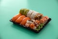 take away sushi package isolated on cyan background