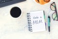 Take a break. Concept time off. Words Take a break in a notebook on the working table with cup of coffee and bun Royalty Free Stock Photo