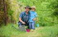 Take care of plants. Boy and father in nature with watering can. Spring garden. Dad teaching little son care plants Royalty Free Stock Photo
