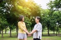 Take care and support concept,Portrait of elderly asian woman with daughter hand holding and laughing at park together,Happy and s Royalty Free Stock Photo