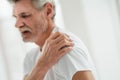 Take care of your health.Senior man suffering from pain in shoulder