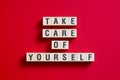 Take care of yourself - word concept on cubes, text