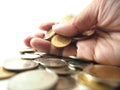 Take coins in hand, pile of money Royalty Free Stock Photo