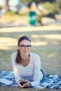 Take a day to do what relaxes you. Portrait of an attractive young woman relaxing in the park. Royalty Free Stock Photo