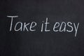 Take it easy chalkboard. Positive inscription Royalty Free Stock Photo