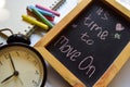 Take the first step phrase colorful handwritten on chalkboard, alarm clock with motivation and education concepts.It`s time to mov Royalty Free Stock Photo