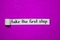 Take the first step text, Inspiration, Motivation and business concept on purple torn paper