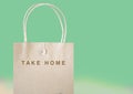 Take Home Paper Bag on Pastel Green Background Royalty Free Stock Photo