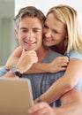 Take a look at this. a happy mature couple using a laptop at home. Royalty Free Stock Photo