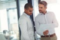 Take a look at this here. businessmen talking over some paperwork in an office. Royalty Free Stock Photo